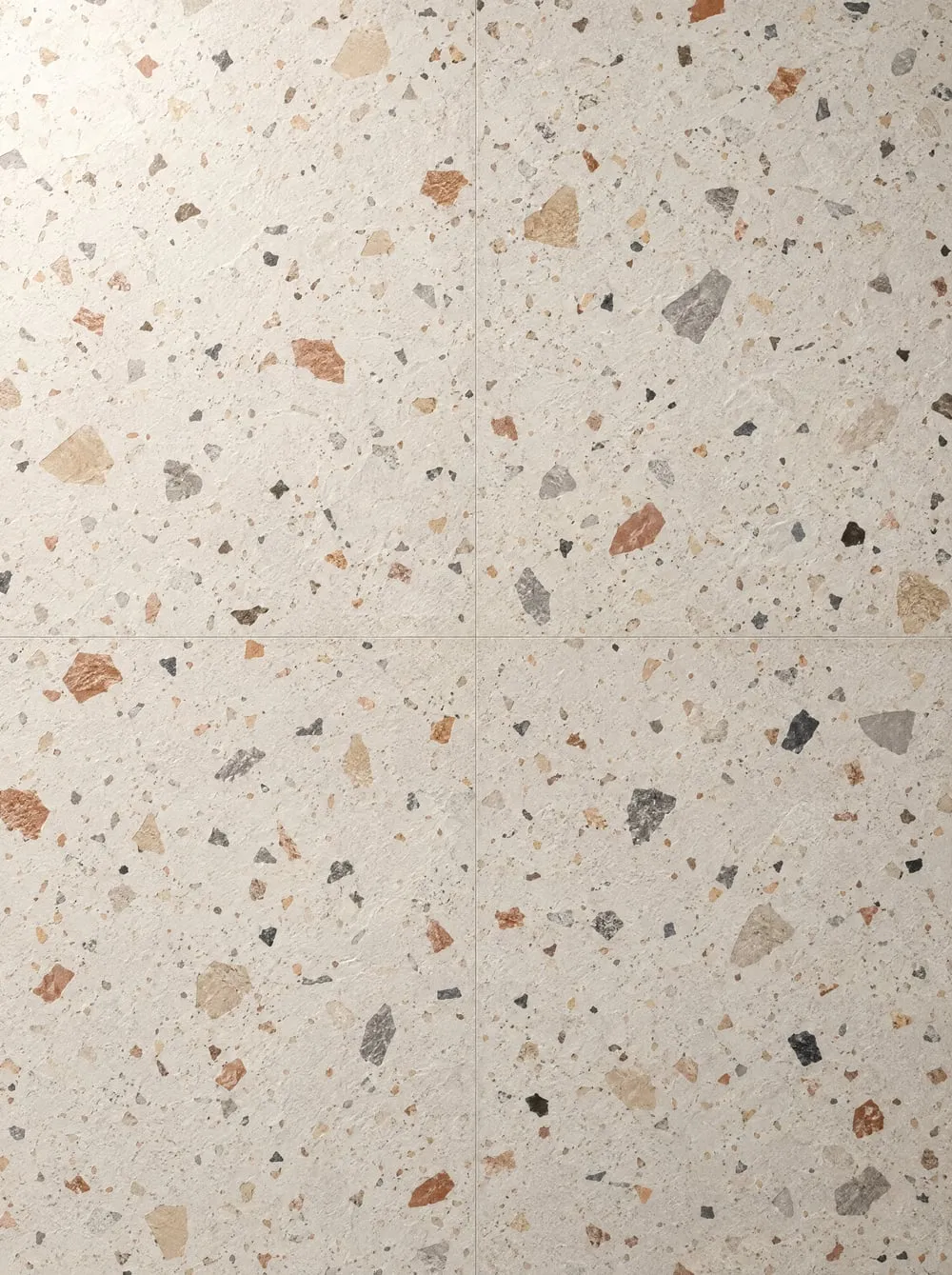 Vinylboden in Terrazzo-Optik mit hellen und dunklen Steinsplittern